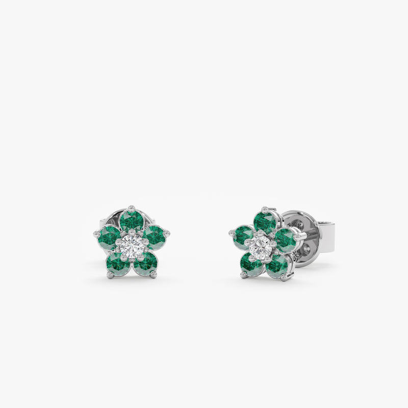 Handcrafted delicate flower shape with green emerald stones and natural diamond  in 14k white gold. 