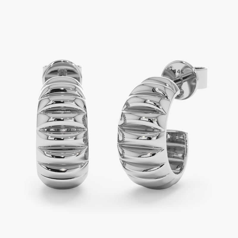 Handmade thick ribbed earring huggie in 14k white gold. 