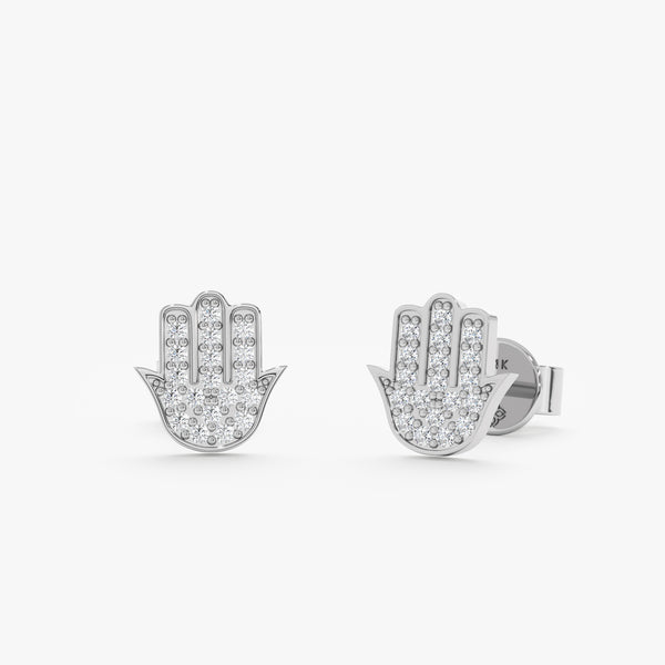 Pair of solid 14k white gold hamsa hand stud earrings with diamonds