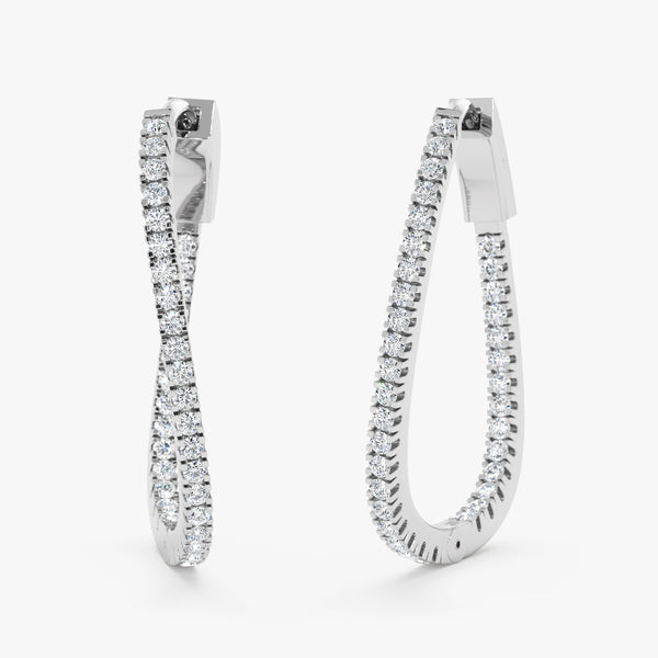 Pair of handmade 14k solid white gold wavy hoop earrings lined with natural diamonds 