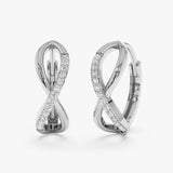 Minimalistic infinity symbol earrings in 14k solid white gold with natural diamonds.