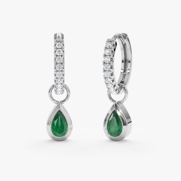 Pair of pear shaped emerald charm huggie hoop earrings in solid 14k white gold
