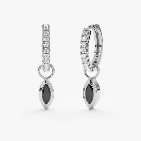 Pair of marquise cut black diamond charm hanging huggie in 14k white gold. 