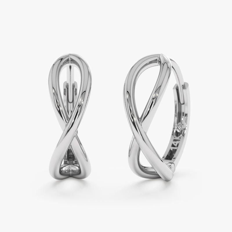 Product Image of simplistic solid gold curved hoops in infinity symbol shape in 14k white gold. 
