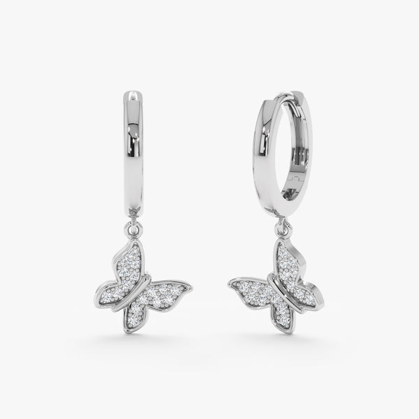 Pair of solid 14k white gold butterfly shape charm huggie earrings 