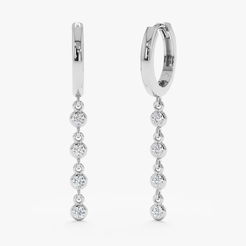 Elegant pair of 14k solid white gold huggies with hanging diamond bezels