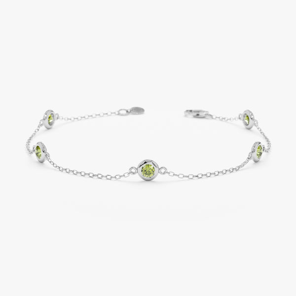 white gold bracelet with natural green peridot