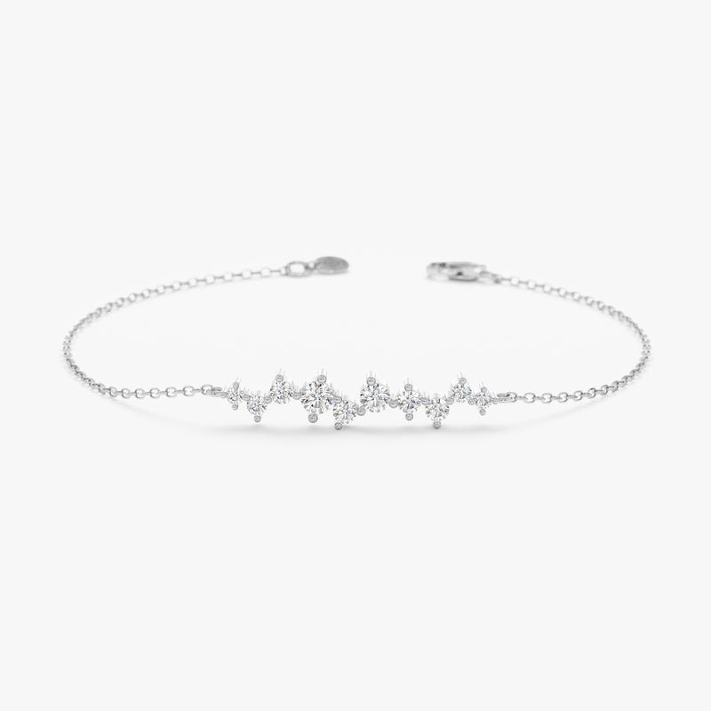 Natural diamond bracelet with dainty clusters on a white gold chain.