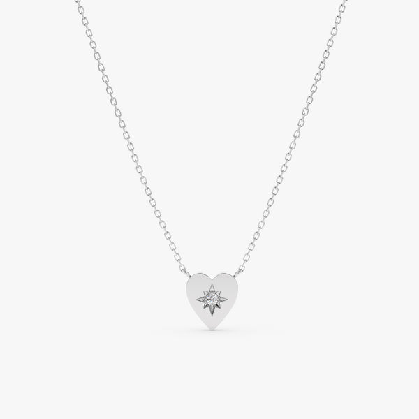 handcrafted 14k white gold necklace with starburst heart pendant and single white diamond