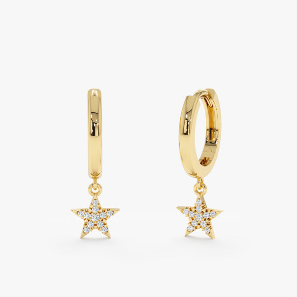 Pair of solid 14k gold star shaped huggies with diamonds