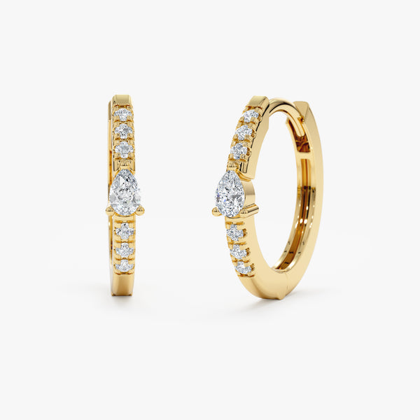yellow gold thin diamond lined hoop earring with pear diamond