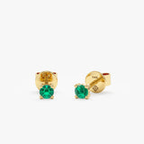 Dainty emerald green studs in 14k solid gold with engraved logo.