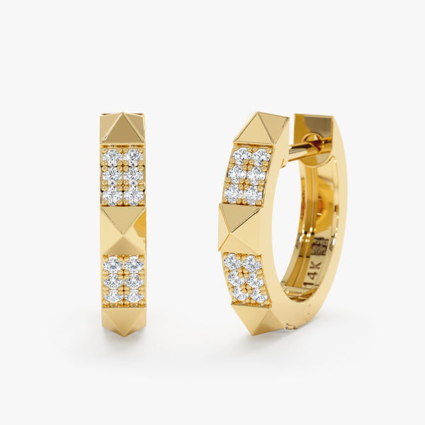 Pair of huggie hoop earrings in 14k solid gold with pyramid spike design lined with natural diamonds