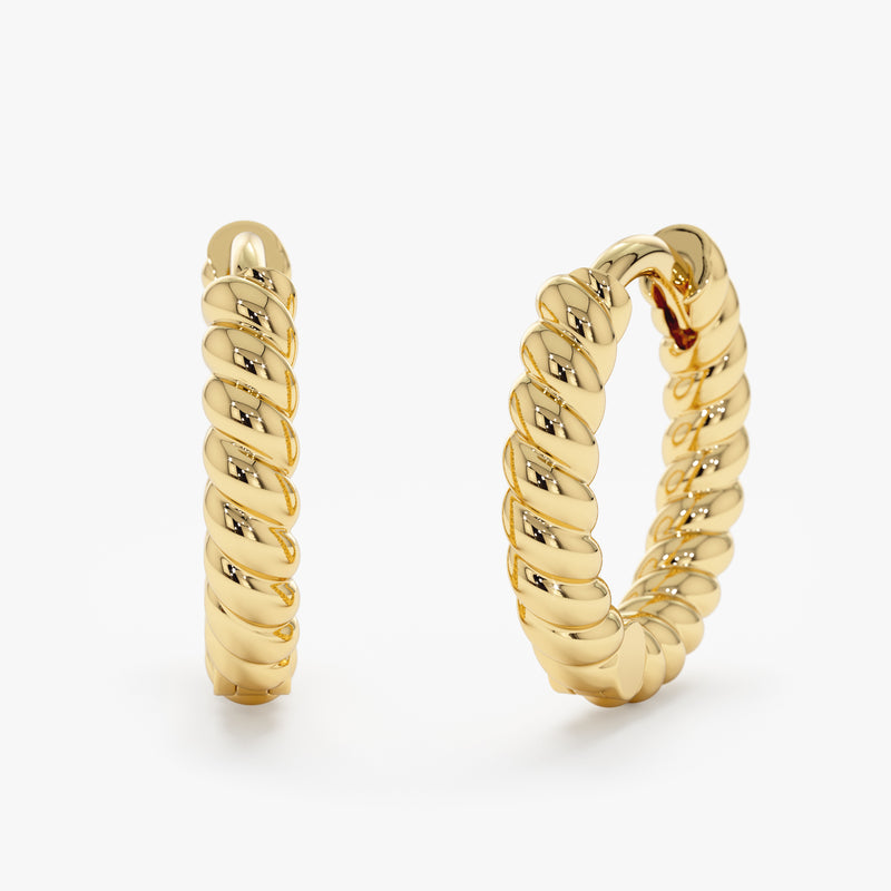 Handmade solid 14k gold twisted hoop earrings.