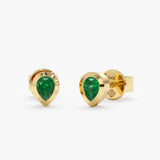 Handcrafted pear cut emerald earring studs in elegant 14k solid gold. 