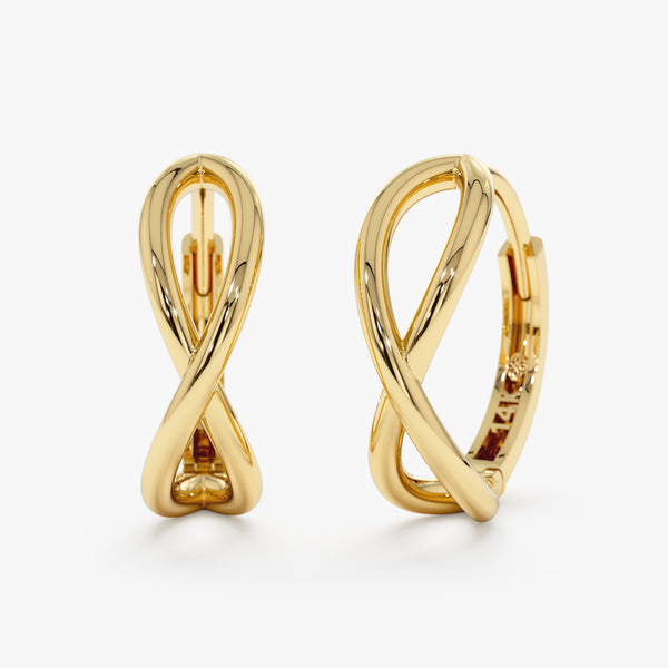 Product Image of Minimalist solid gold hoops in curved infinity symbol shape.