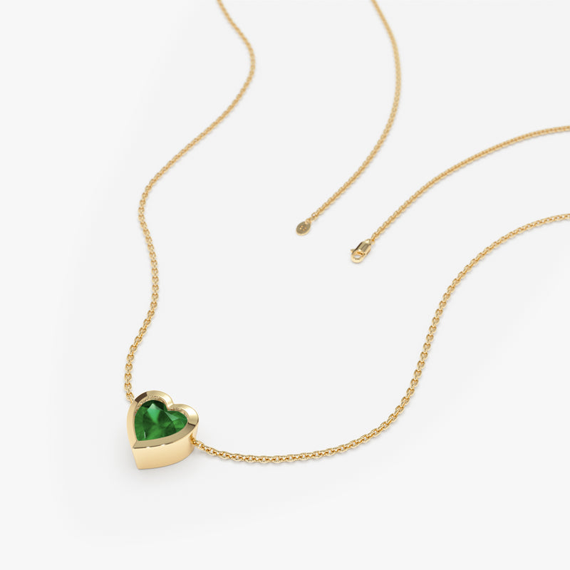 petite green gem heart in solid gold