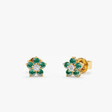 Handmade flower design in emeralds with natural diamond in the middle made in 14k solid gold. 