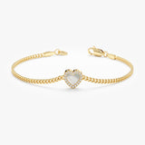Gold Cuban chain bracelet with pearl heart