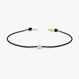 yellow gold black string bracelet with diamond star charm