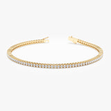 Diamond eternity bracelet crafted in solid gold.