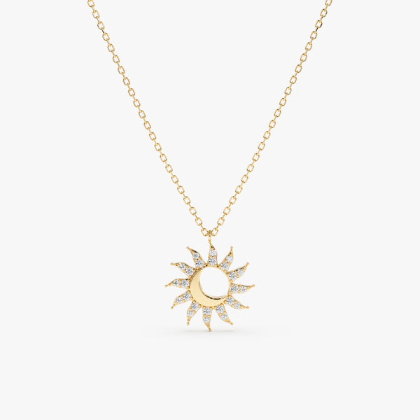 handcrafted gold sun and moon pendant with radiating diamonds