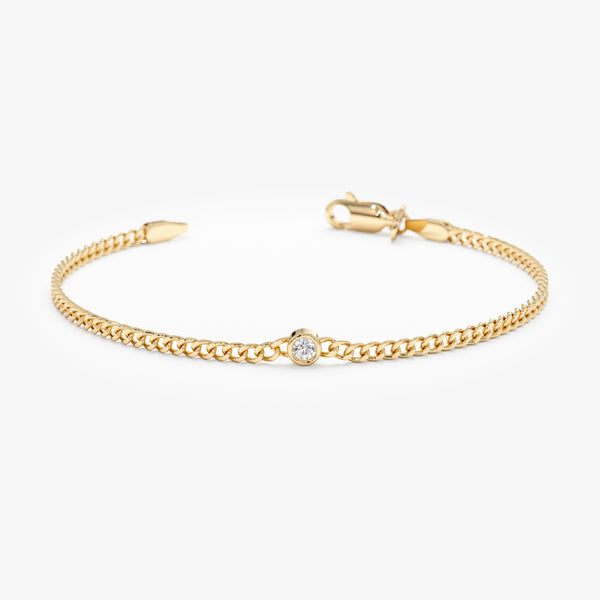 Diamond solitaire Cuban chain bracelet in solid gold.