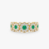 vintage emerald diamond floral ring featuring natural green emeralds and diamonds in a scalloped halo design