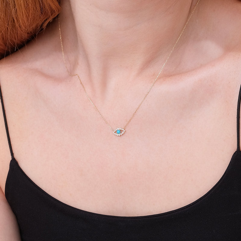 petite eye pendant necklace with lined diamonds and single turquoise stone 