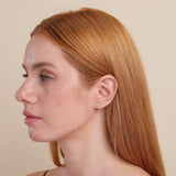 Model wearing delicate Natural diamond earring studs handmade in 14k solid gold.