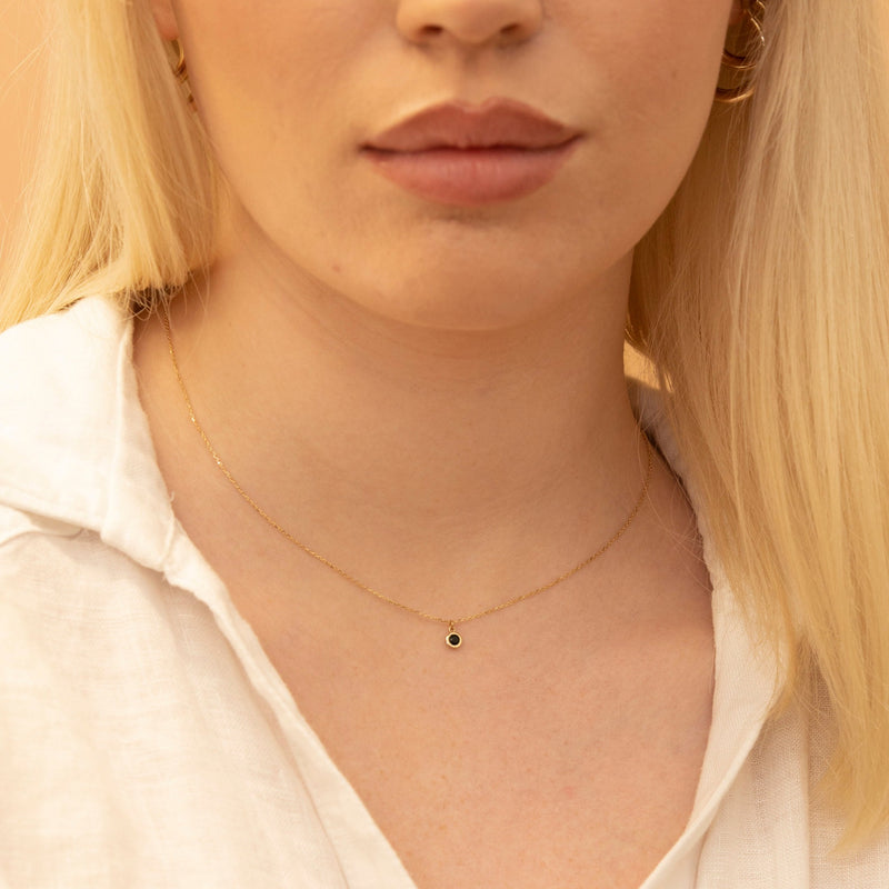bezel set black stone pendant