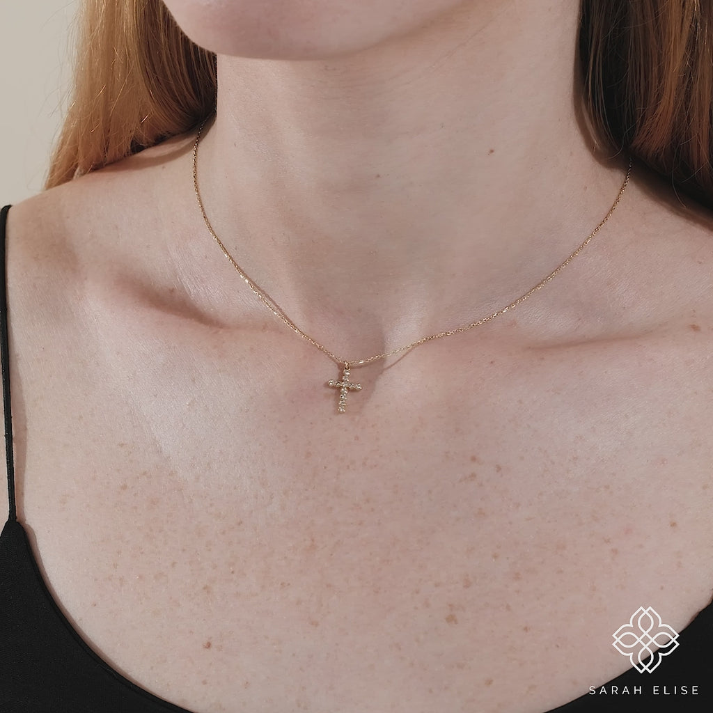 dainty necklace in solid gold with diamond cross pendant