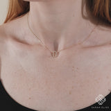 solid gold necklace with diamond lined hamsa hand pendant 