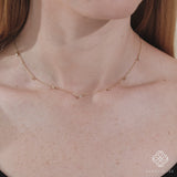 handcrafted dainty solid gold necklace with multiple natural diamonds