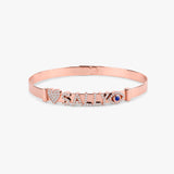 Sleek rose gold bangle designed for a variety of decorative charm options.