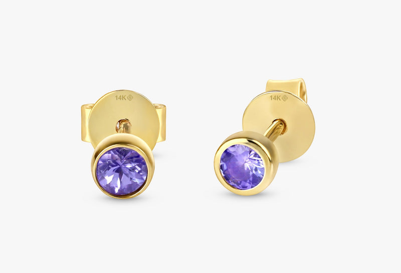 handmade pair of solid 14k gold stud earrings with amethyst bezel