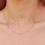 handmade necklace with multiple hanging diamond clover charms
