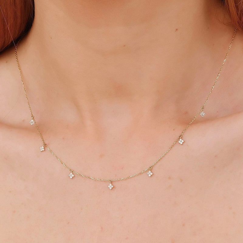 handmade necklace with multiple hanging diamond clover charms