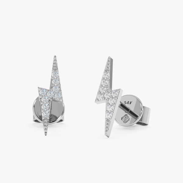 handcrafted pair of solid 14k white gold stud earrings lightning bolt design with diamonds