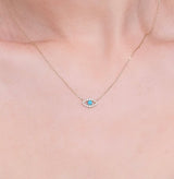 dainty solid gold necklace with turquoise eye pendant and natural diamonds
